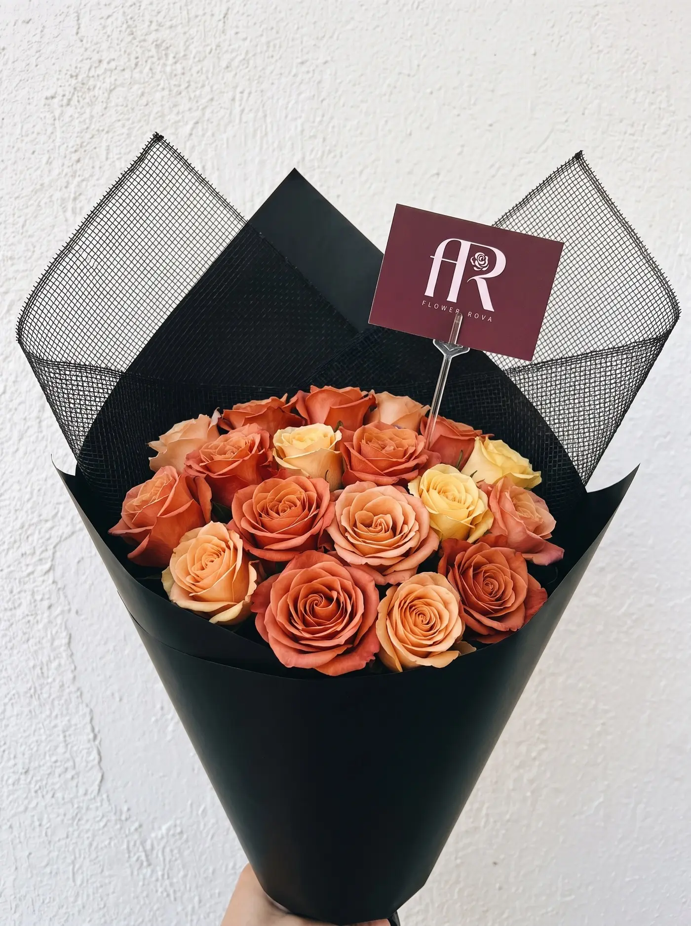 Orange Mix roses hand-tied by FlowerRova, Bangkok