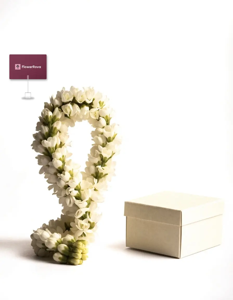 Jasmine garland beside an open box of assorted chocolates (5 pieces), product visualisation