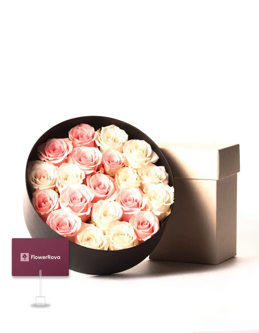 Preserved roses in a box beside an open box of assorted chocolates (24 pieces), product visualisation