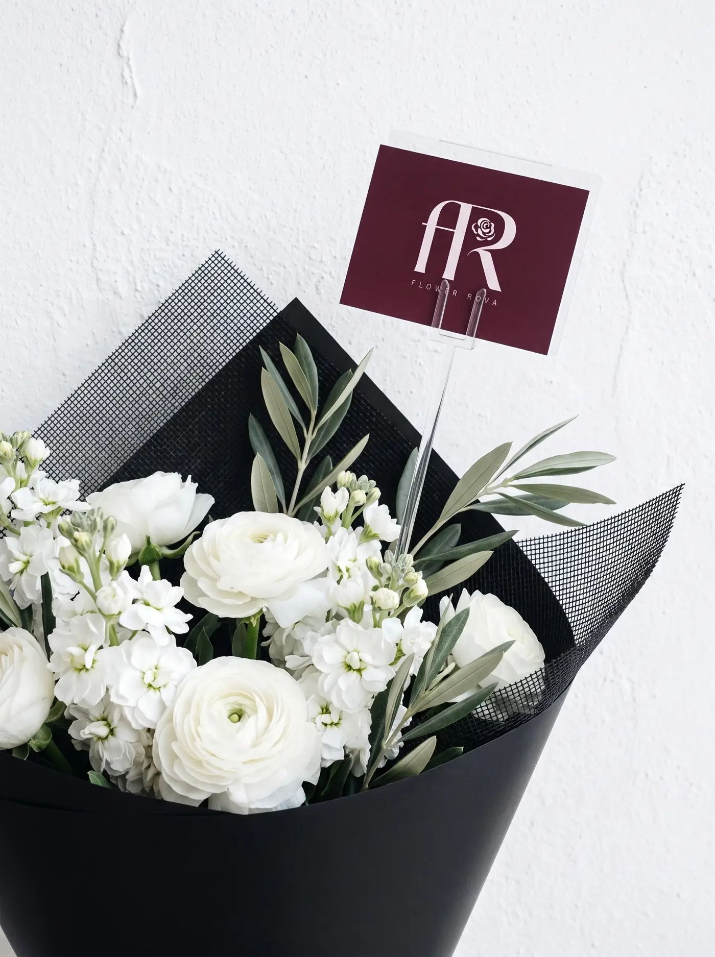 The White Room — white ranunculus ×11 · stock ×7 · olive ×6, hand-tied by FlowerRova in Bangkok