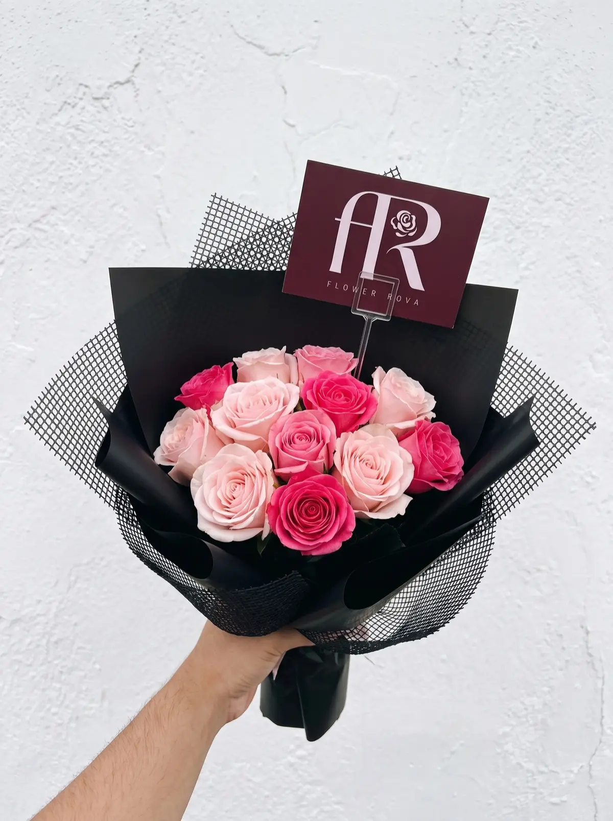 10 Pink Roses hand-tied in FlowerRova's black atelier wrap, Bangkok