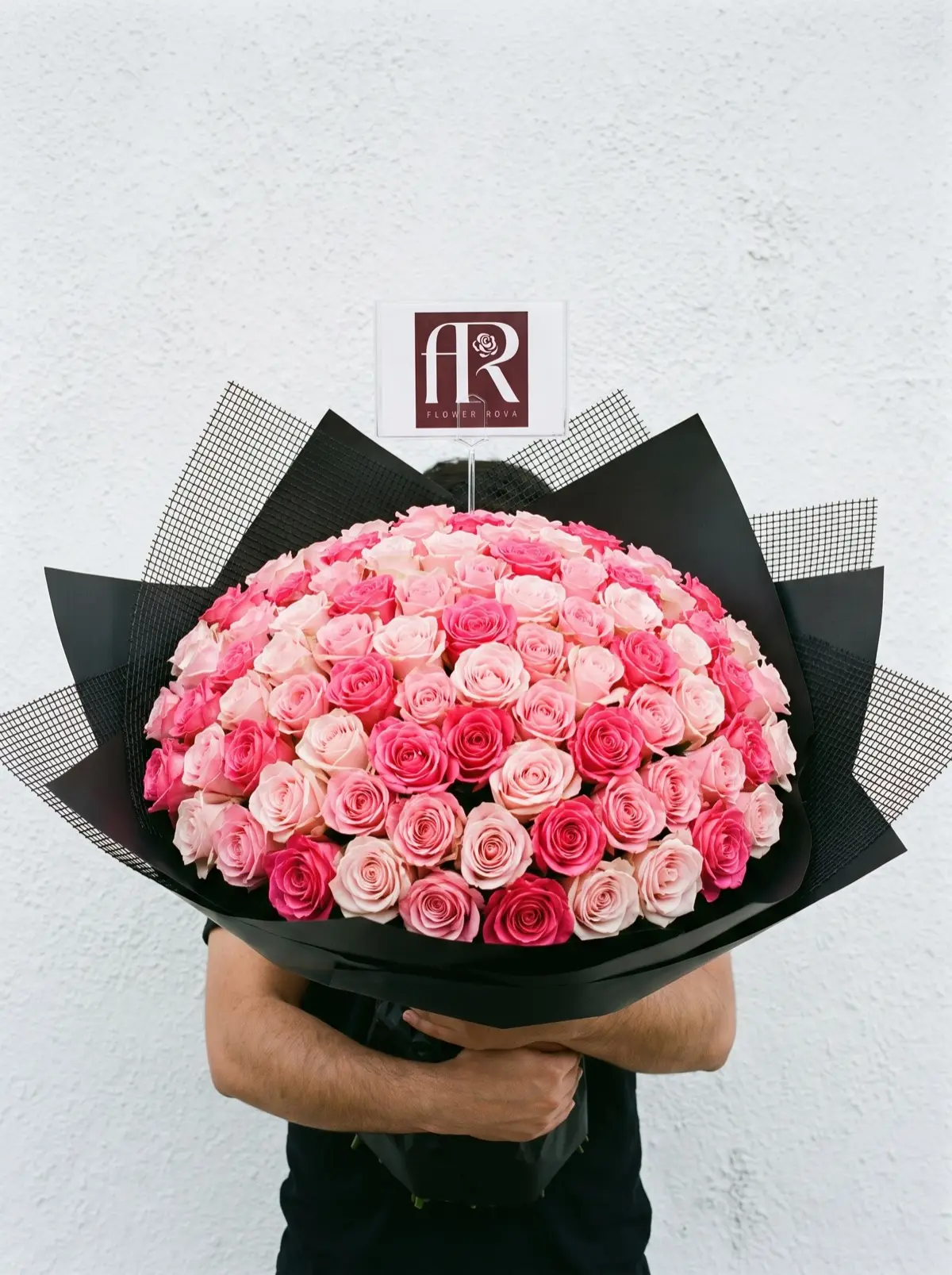100 Pink Roses hand-tied in FlowerRova's black atelier wrap, Bangkok