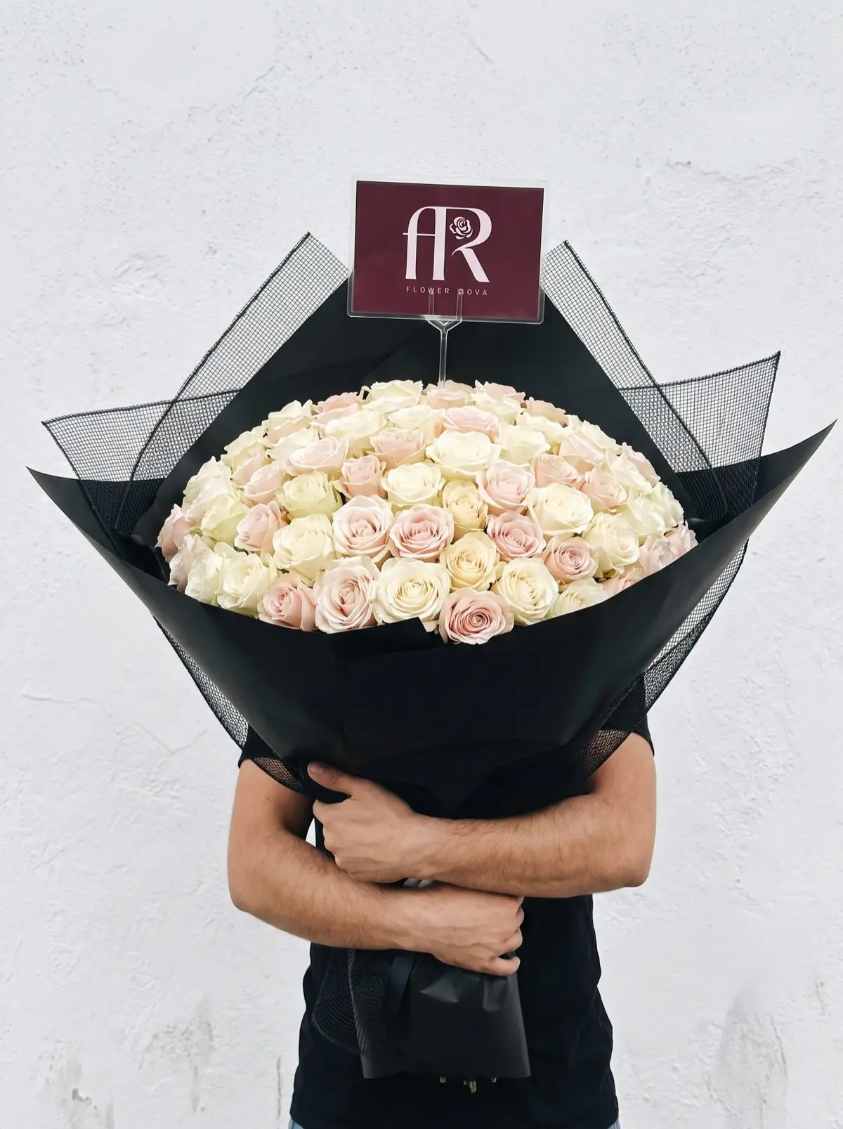100 White + Pink Roses hand-tied in FlowerRova's black atelier wrap, Bangkok