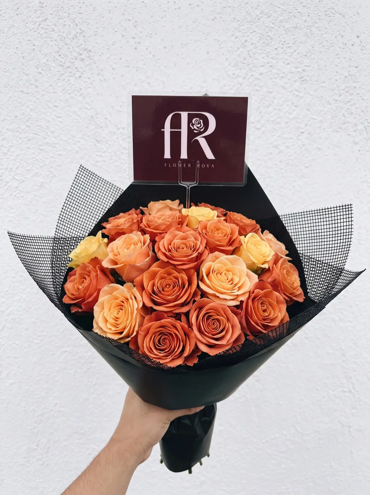 20 Orange Roses hand-tied in FlowerRova's black atelier wrap, Bangkok