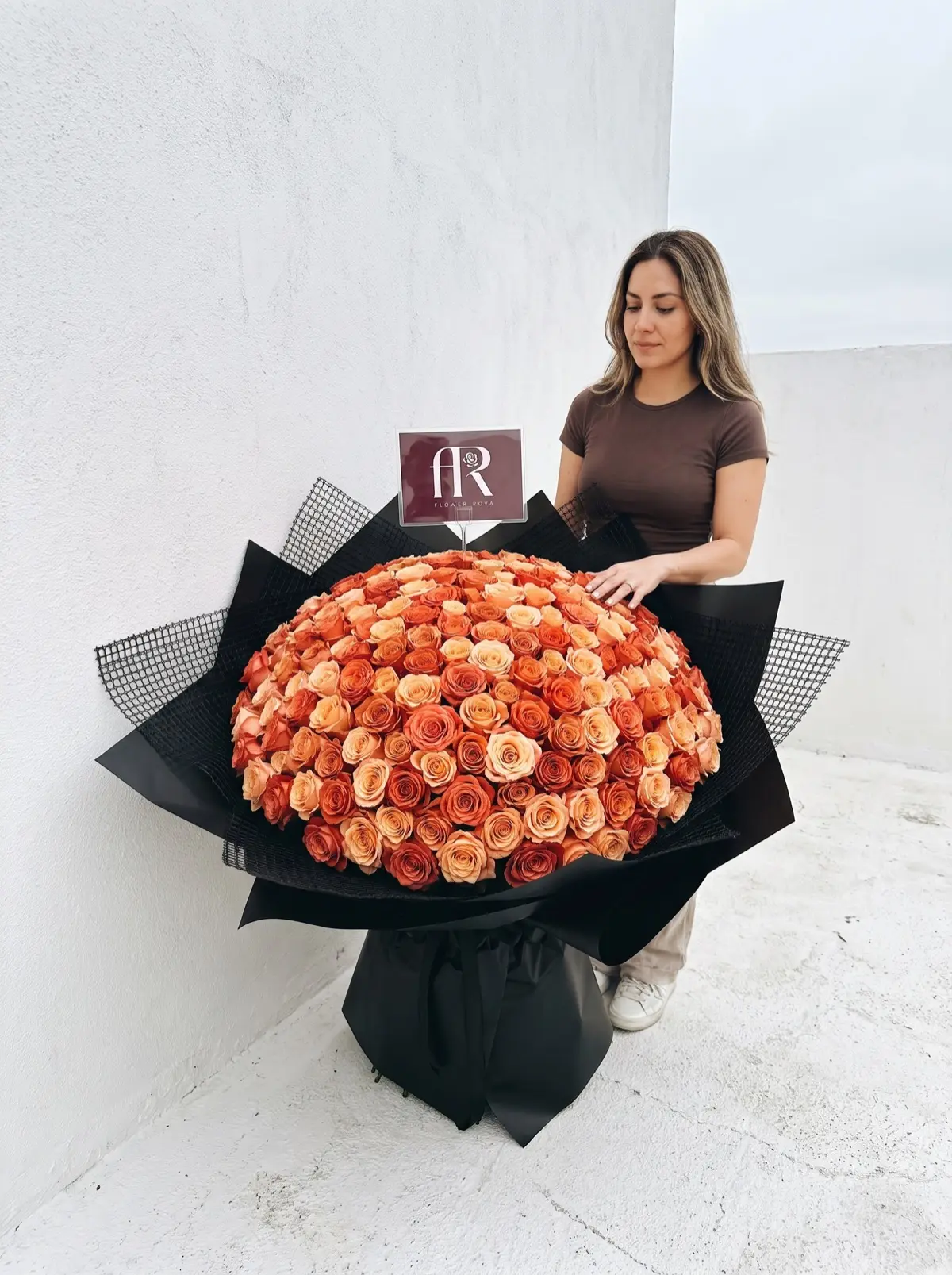 200 Orange Roses hand-tied in FlowerRova's black atelier wrap, Bangkok