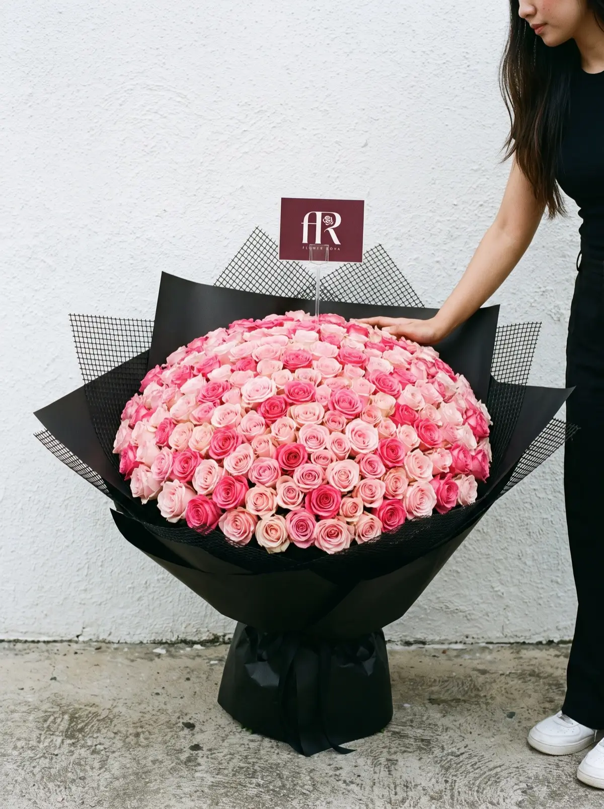 200 Pink Roses hand-tied in FlowerRova's black atelier wrap, Bangkok