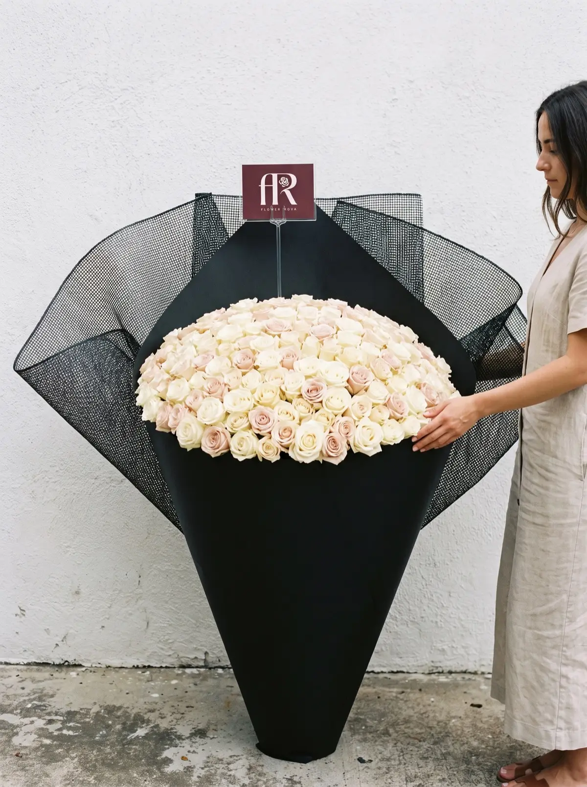 300 White + Pink Roses hand-tied in FlowerRova's black atelier wrap, Bangkok