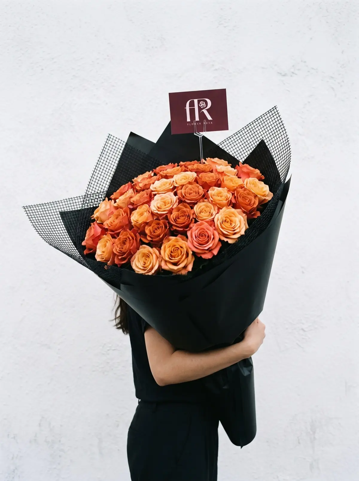 50 Orange Roses hand-tied in FlowerRova's black atelier wrap, Bangkok