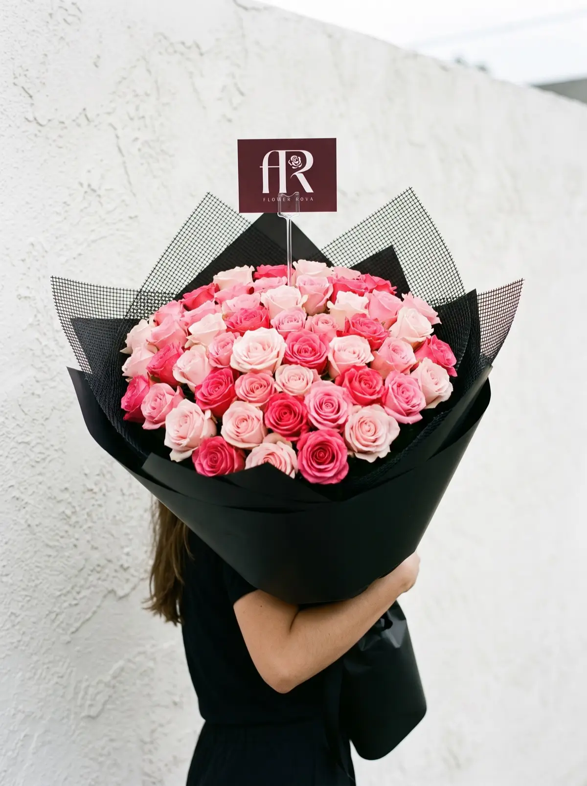50 Pink Roses hand-tied in FlowerRova's black atelier wrap, Bangkok