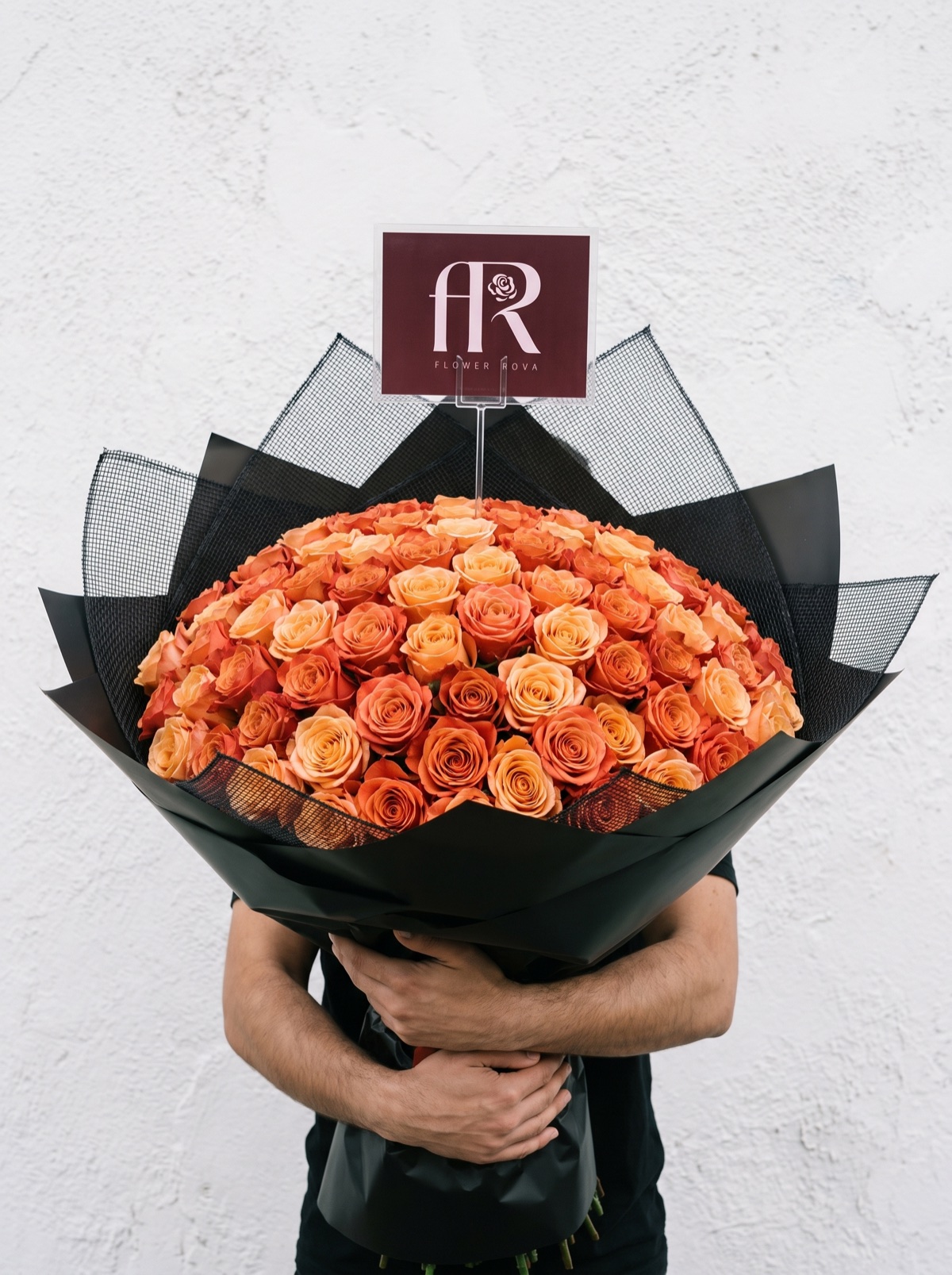 100 Orange Roses hand-tied in FlowerRova's black atelier wrap, Bangkok