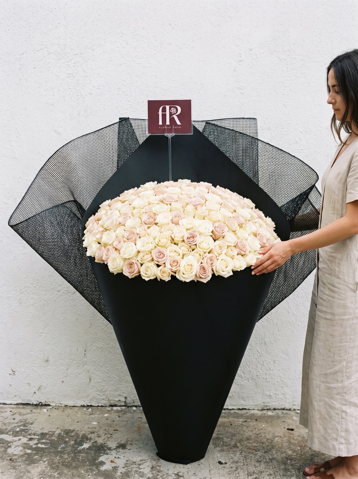 300 White + Pink Roses hand-tied in FlowerRova's black atelier wrap, Bangkok