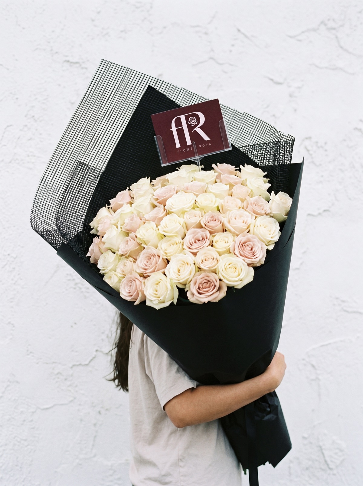 50 White + Pink Roses hand-tied in FlowerRova's black atelier wrap, Bangkok